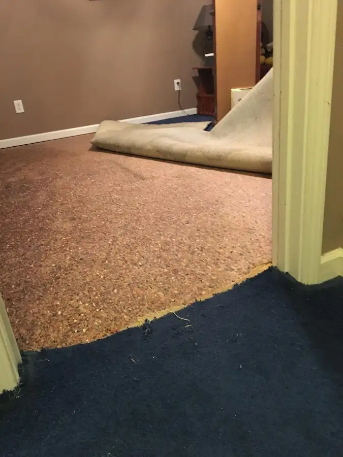 Carpet pad removal revealing water damage during Drying & Dehumidification in Camas